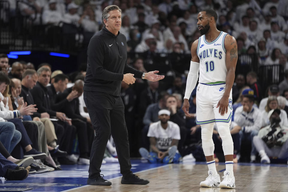 Minnesota Timberwolves head coach Chris Finch and guard Mike Conley (10) talk during the second half of Game 2 of an NBA basketball first-round playoff series against the Phoenix Suns, Tuesday, April 23, 2024, in Minneapolis. (AP Photo/Abbie Parr)