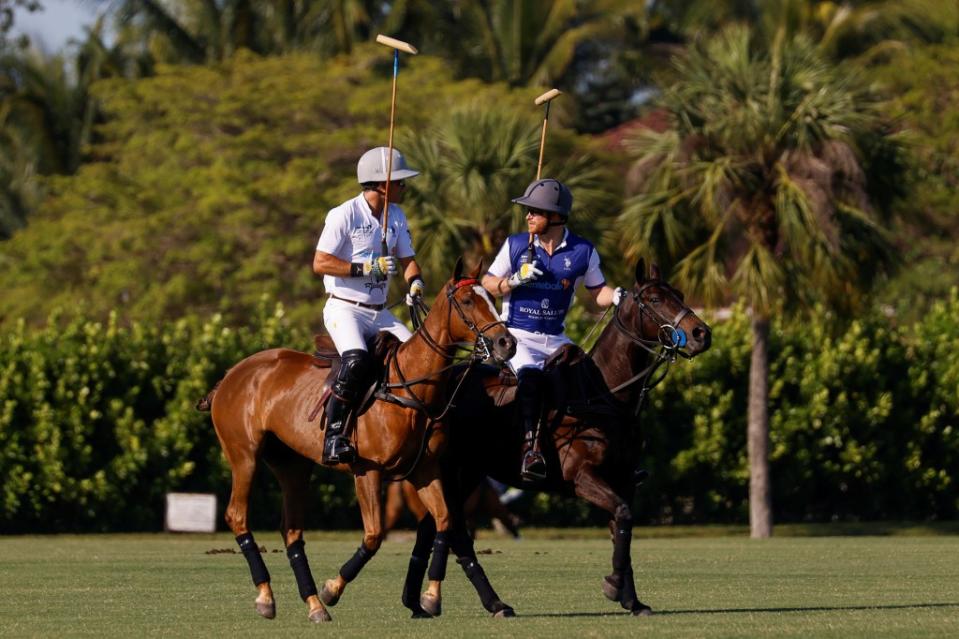 Prince Harry and Argentine polo player Nacho Figueras participate in the Royal Salute Polo Challenge. REUTERS