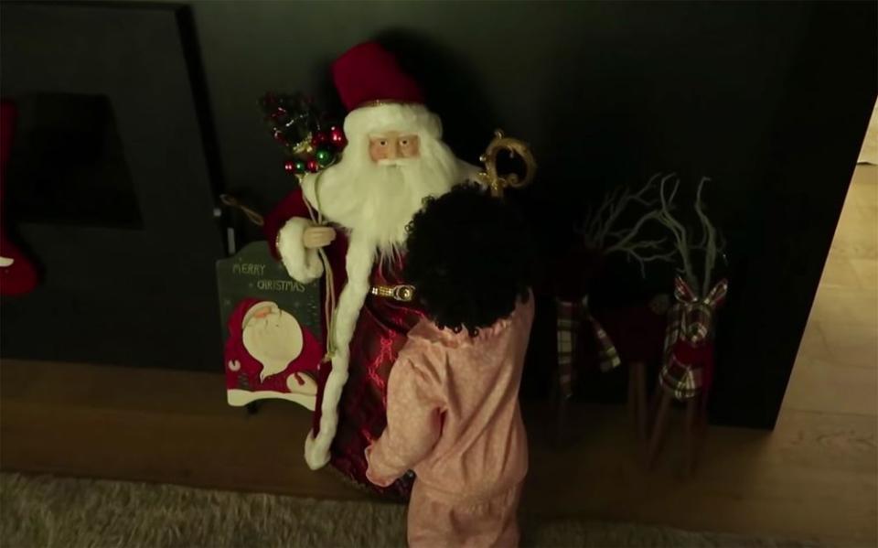 Stormi and a Santa decoration | Kylie Jenner/Youtube