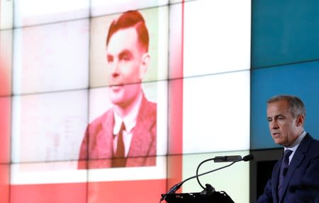 Bank of England governor Mark Carney presents the image of mathematician Alan Turing who will appear on a new 50 pound note at the Science and Industry Museum in Manchester