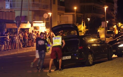 Spanish Policemen inspect a car in Cambrils - Credit: EPA