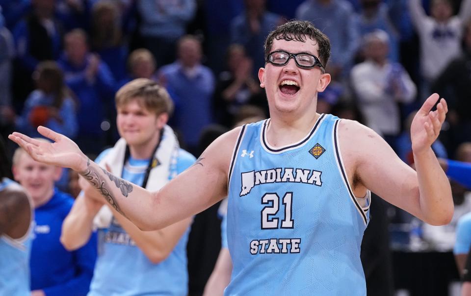 Indiana State center Robbie Avila yells in excitement after the Sycamores defeated Cincinnati in the NIT quarterfinals at the Hulman Center in Terre Haute on March 26, 2024.