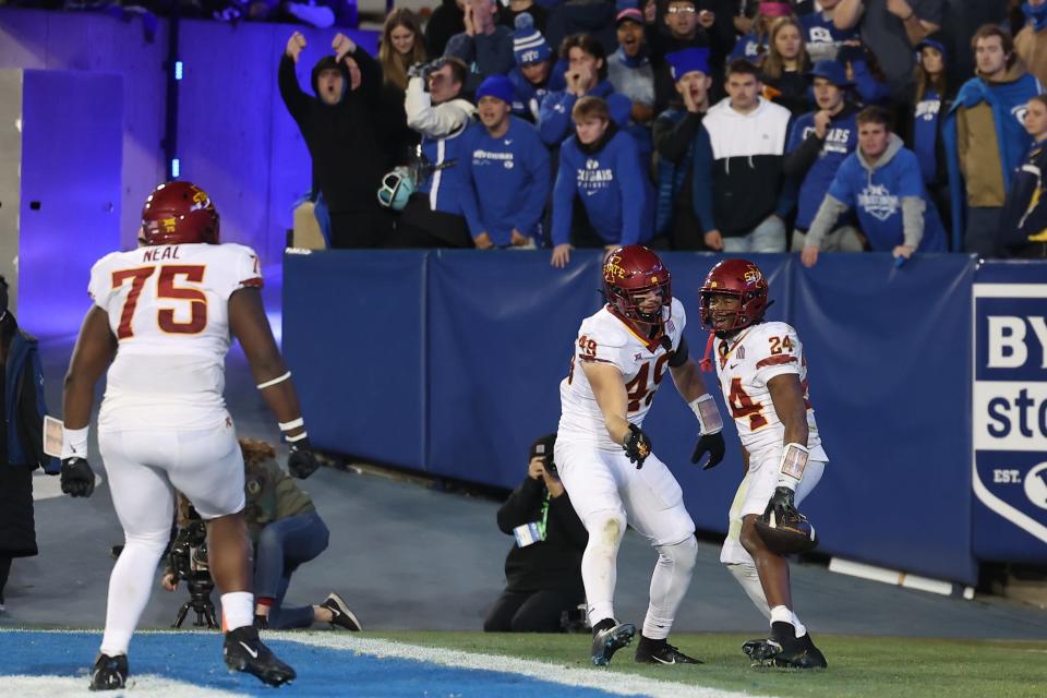 Iowa State's James Neal, left, rushes to congratulate Abu Sama after a touchdown last season at BYU.