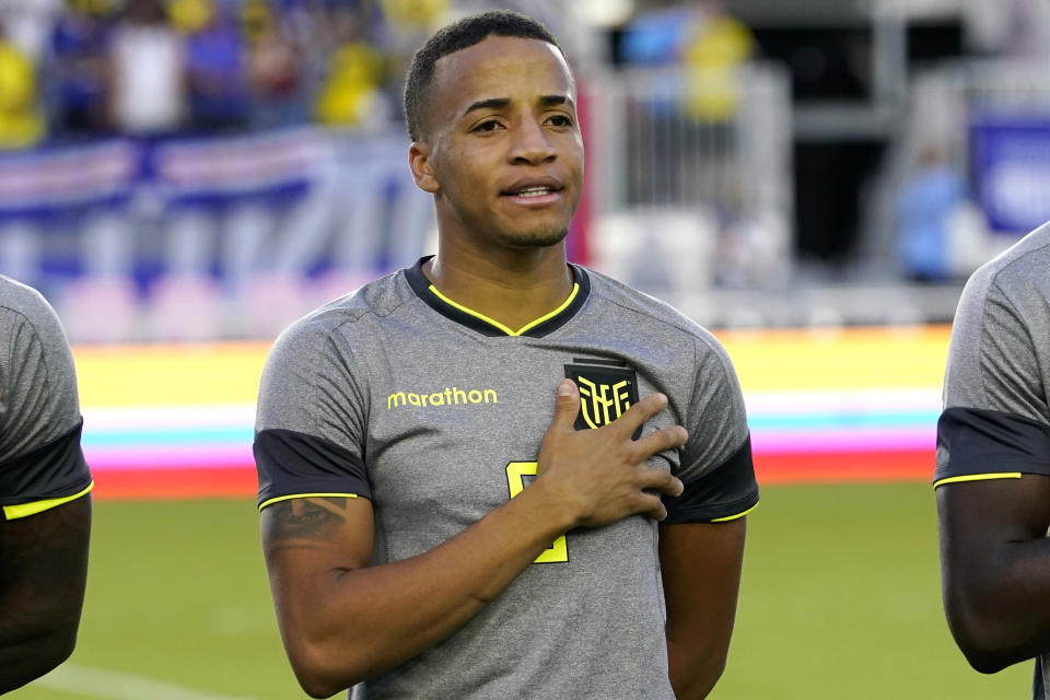 FILE - Ecuador's Byron Castillo stands for the national anthem before the team's international friendly soccer match against Cape Verde, Saturday, June 11, 2022, in Fort Lauderdale, Fla. FIFA has given Chile an appeal hearing on Sept. 15, 2022 to challenge Ecuador’s place at the 2022 World Cup over an alleged ineligible player. FIFA said Thursday, Sep. 1, 2022 its appeal committee has invited Byron Castillo, the Ecuador player at the center of the dispute, to be available as a witness. (AP Photo/Lynne Sladky, File)