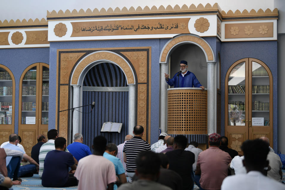 Imam Sidi Mohammed Zaki, preaches in a mosque in Athens, Greece, Friday, Oct. 13, 2023. In Muslim communities across the world, worshippers gathered at mosques for their first Friday prayers since Hamas militants attacked Israel, igniting the latest Israel-Palestinian war. (AP Photo/Michael Varaklas)