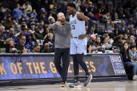 Memphis Grizzlies head coach Taylor Jenkins talks with forward Jaren Jackson Jr. (13) in the second half of an NBA basketball game against the Portland Trail Blazers, Wednesday, Feb. 1, 2023, in Memphis, Tenn. (AP Photo/Brandon Dill)