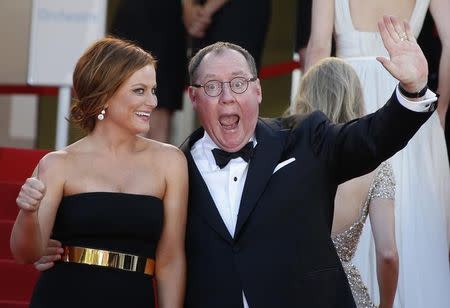 Voice actress Amy Poehler (L) and executive producer John Lasseter pose on the red carpet as they arrive for the screening of the animated film "Inside Out" (Vice Versa) out of competition at the 68th Cannes Film Festival in Cannes, southern France, May 18, 2015. REUTERS/Eric Gaillard