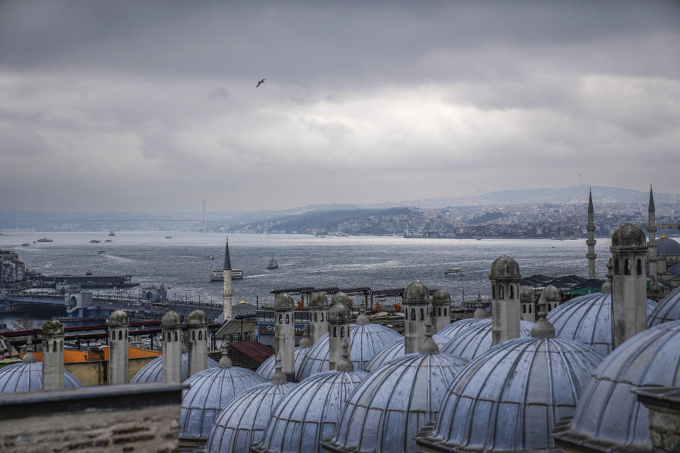 Ferry boats cross the Bosphorus in Istanbul, Turkey, Friday, March 15, 2024. (AP Photo/Khalil Hamra)