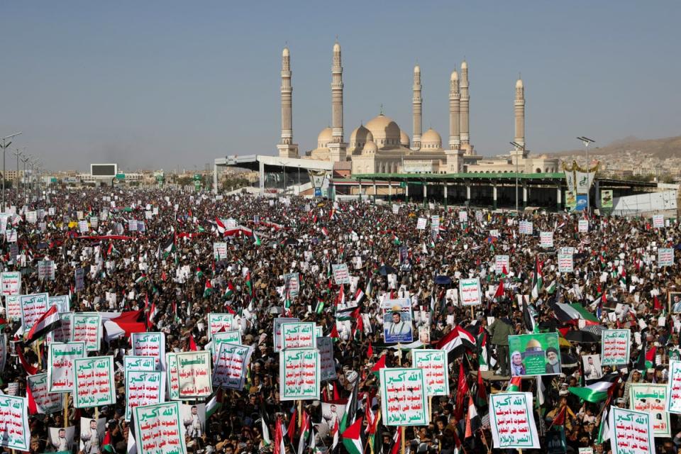 Supporters of the Houthi movement rally to denounce air strikes launched by the US and Britain on Houthi targets, in Sanaa, Yemen 12 January 2024 (Reuters)