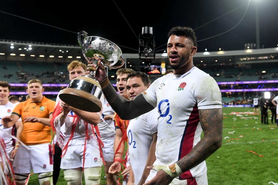 Seen here, England captain Courtney Lawes celebrates the series victory over the Wallabies by holding the Ella-Mobbs Cup aloft. 