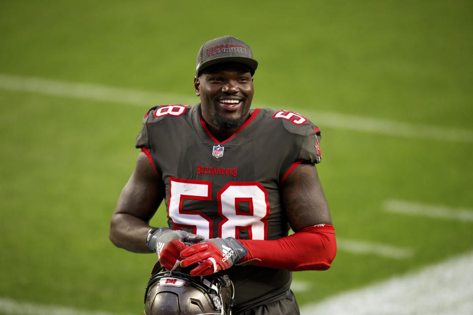 Tampa Bay Buccaneers linebacker Shaquil Barrett (58) smiles while running off the field after defeating the Denver Broncos in an NFL football game, Sunday, Sept.. 27, 2020, in Denver. (AP Photo/Justin Edmonds)