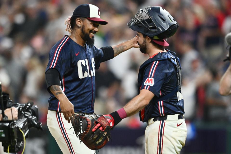 Cleveland Guardians relief pitcher Emmanuel Clase (48) celebrates with catcher Austin Hedges (27) after the Guardians beat the Pittsburgh Pirates on Friday in Cleveland.