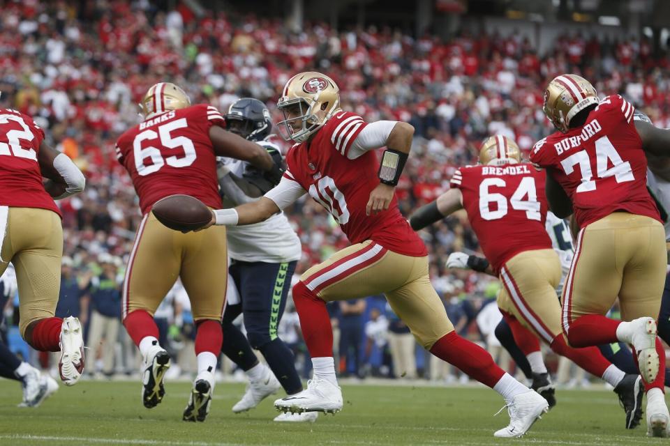 San Francisco 49ers quarterback Jimmy Garoppolo (10) looks to hand the ball off against the Seattle Seahawks.