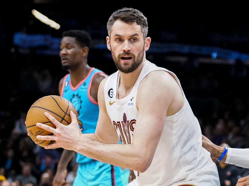 FILE - Cleveland Cavaliers' Kevin Love, foreground, controls the ball during an NBA basketball game against the Phoenix Suns in Phoenix, Jan. 8, 2023. Love was not moved at the NBA's trade deadline, and the Cavaliers do not expect him to leave anytime soon. Although Love has been temporarily dropped from Cleveland's rotation, Cavs president of basketball operations Koby Altman said Thursday, Feb. 9, 2023, that he has not had any discussions with the five-time All-Star about a contract buyout. (AP Photo/Darryl Webb, File)