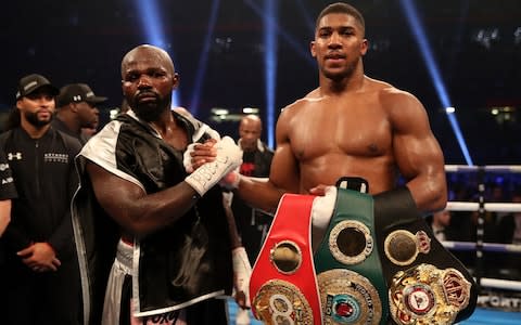 Anthony Joshua celebrates victory over Carlos Takam - Credit: PA