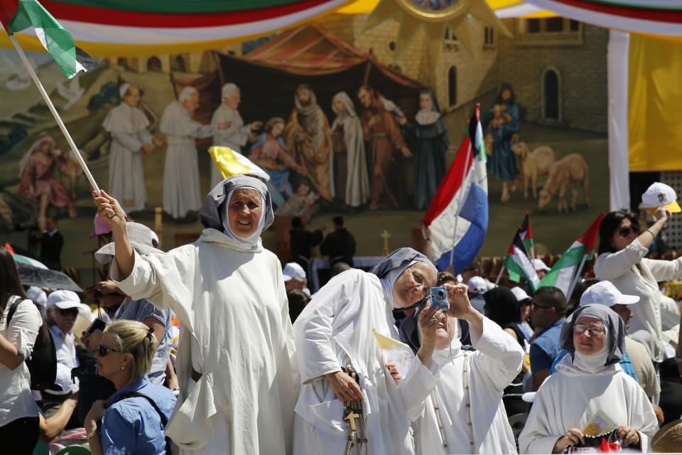 Nuns await the arrival of Pope Francis in the West Bank city of Bethlehem