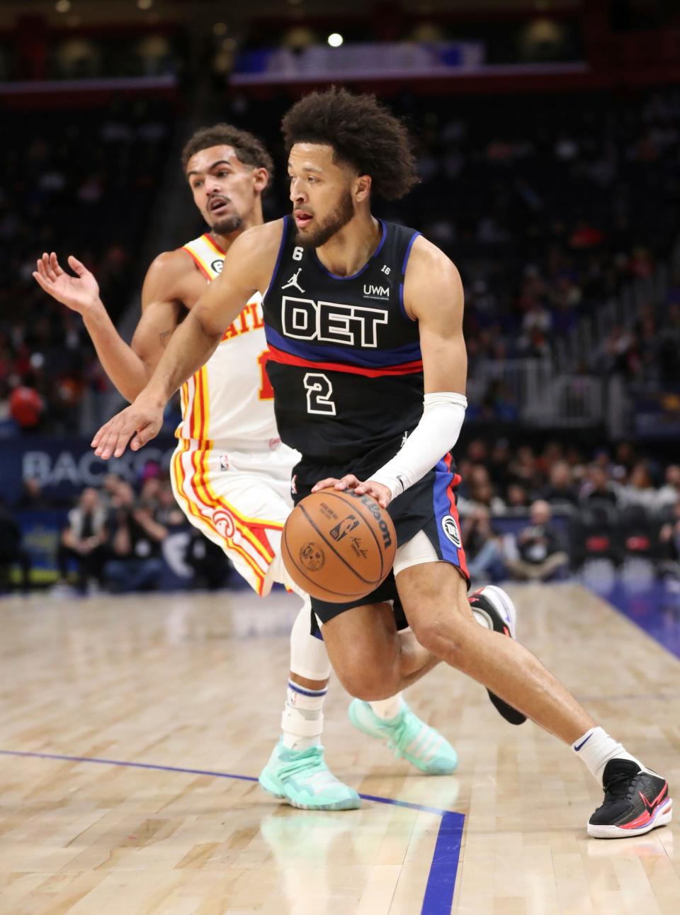 Detroit Pistons guard Cade Cunningham (2) drives against Atlanta Hawks guard Trae Young (11) during first-quarter action on Wednesday, Oct. 26, 2022, at Little Caesars Arena in Detroit.