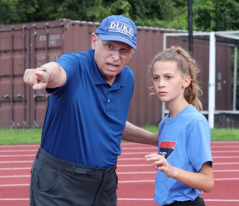 Longtime Rockland volunteer track coach Don Schlesinger, works with Sunny Prinz, 10, of New City at Clarkstown South High School July 20, 2023. Prinz will be competing in the national Junior Olympics.