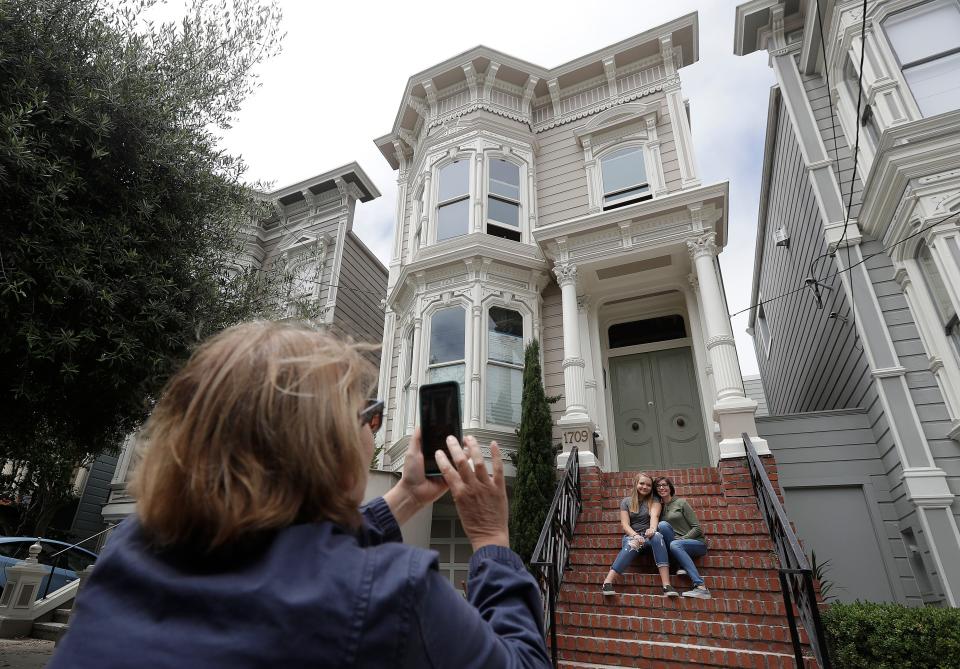 Tourists taking on the steps of the "Full House" home.