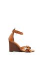 <p><a class="link " href="https://www.loewe.com/eur/en/women/shoes/espadrilles-and-wedges/gate-wedge-sandal-in-calfskin/453.10.637-3649.html?cgid=w_shoes_espadrille&p=16" rel="nofollow noopener" target="_blank" data-ylk="slk:SHOP NOW;elm:context_link;itc:0;sec:content-canvas">SHOP NOW</a></p><p>Calfskin wedge sandals, £362, Loewe</p>