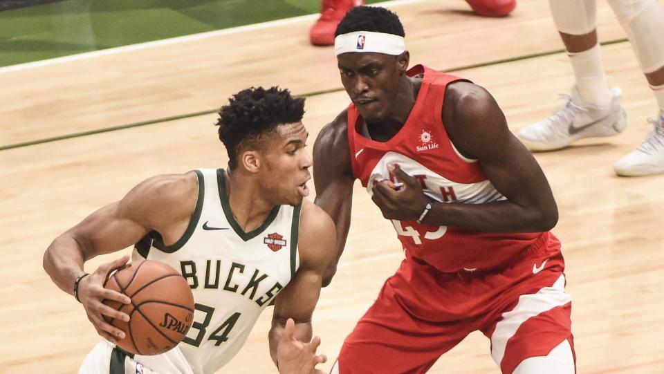 May 23, 2019; Milwaukee, WI, USA; Milwaukee Bucks forward Giannis Antetokounmpo (34) dribbles the ball as Toronto Raptors forward Pascal Siakam (43) defends in the first quarter in game five of the Eastern conference finals of the 2019 NBA Playoffs at Fiserv Forum. Mandatory Credit: Benny Sieu-USA TODAY Sports