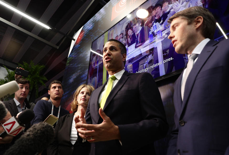 U.S. Deputy Assistant secretary for Cyber and International Communications and Information Policy Robert Strayer, right, and Ajit Pai, chairman of the Federal Communications Commission, centre, attend a press conference at the Mobile World Congress wireless show, in Barcelona, Spain, Tuesday, Feb. 26, 2019. The annual Mobile World Congress (MWC) runs from 25-28 February in Barcelona, where companies from all over the world gather to share new products. (AP Photo/Manu Fernandez)