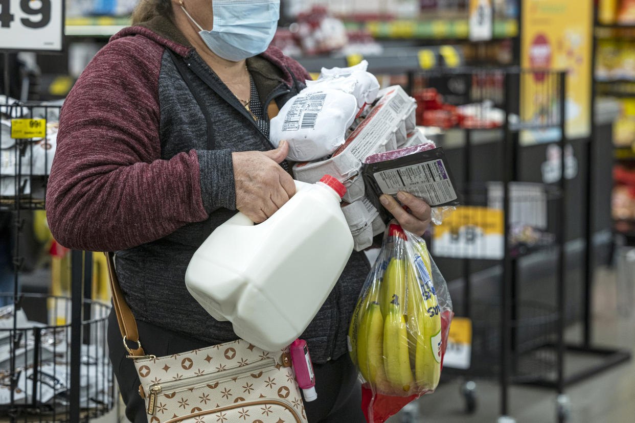 A shopper holds groceries while waiting to checkout inside a grocery store in San Francisco, California, U.S., on Monday, May 2, 2022. U.S. inflation-adjusted consumer spending rose in March despite intense price pressures, indicating households still have solid appetites and wherewithal for shopping. (David Paul Morris / Bloomberg via Getty Images file)