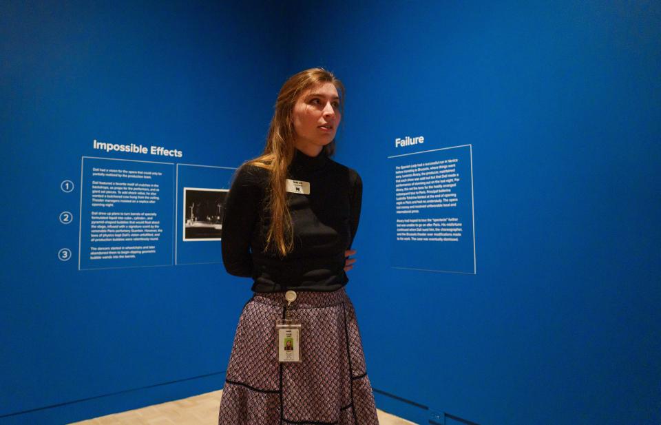 Sadie Arft, curatorial assistant at Newfields, talks Friday, March 1, 2024, about four large watercolor paintings by Salvador Dalí from the IMA’s permanent collection on display as part of the new "Dalí Alive" at the Lume. The pieces haven't been on display since 1979.