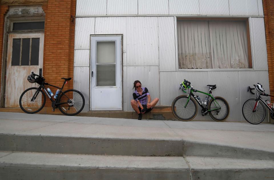 A member of the RAGBRAI route inpsection team pauses in the pass-through town of Kingsley.