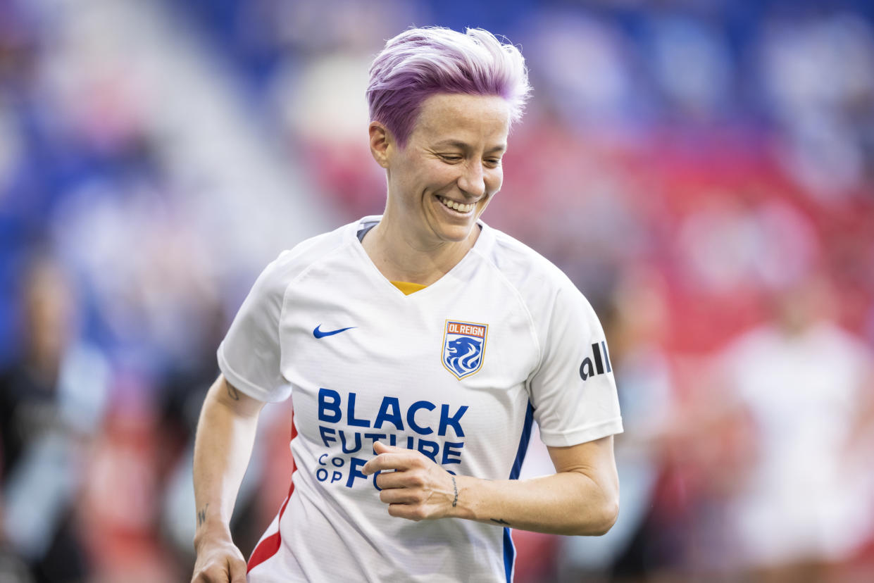 HARRISON, NJ - JUNE 05: Megan Rapinoe #15 of OL Reign is all smiles as she heads to take a corner kick in the first half of the match against NJ/NY Gotham FC at Red Bull Arena on June 5, 2021 in Harrison, New Jersey. (Photo by Ira L. Black - Corbis/Getty Images)