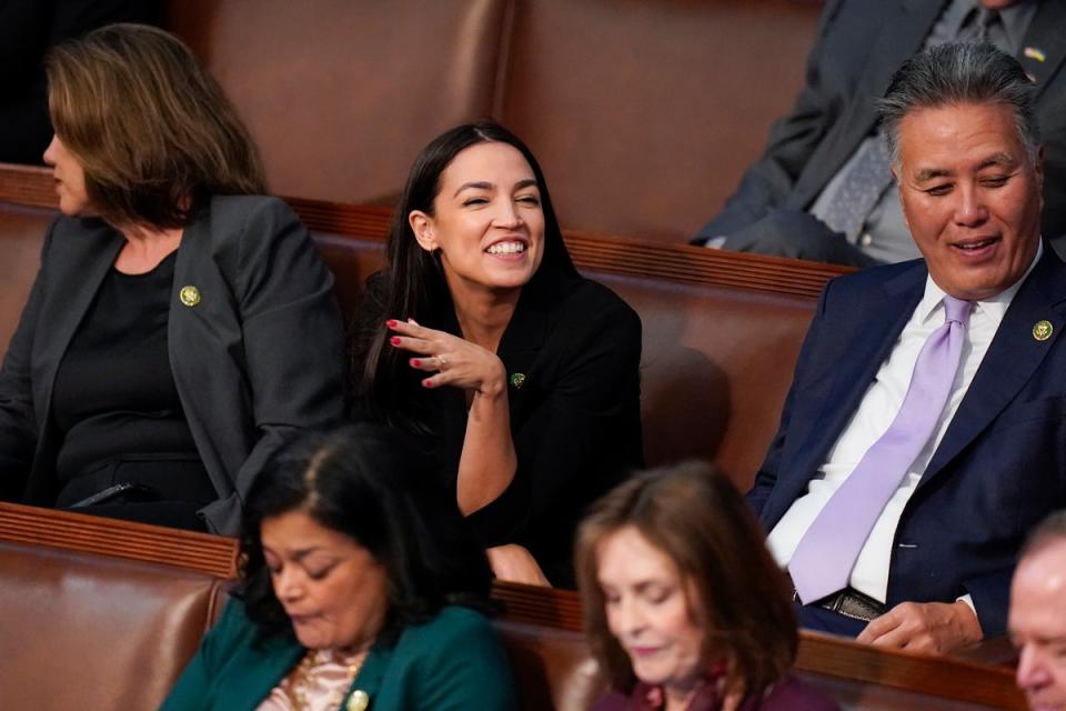 Alexandria Ocasio-Cortez has at times been pictured laughing on the House floor during the Republican impasse – but she says there are serious downsides to the failure to elect a Speaker (AP)