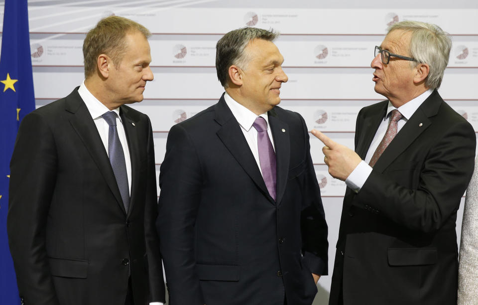 FILE - In this May 22, 2015 file photo, European Commission President Jean-Claude Juncker, right, and European Council President Donald Tusk, left, greet Hungary's Prime Minister Viktor Orban during a summit in Riga, Latvia. Across the European Union, a three-month campaign has begun ahead of May’s election for the European Parliament, a massive exercise in democracy that spans 27 nations and close to half a billion people. This year could be a tipping point in post-war European history. Some traditional political powerhouses might start to crumble and extremist, populist parties might gain more clout. The next parliament will have 705 seats, since Britain is to leave and won’t be taking part in the May 23-26 vote. (AP Photo/Mindaugas Kulbis, File)