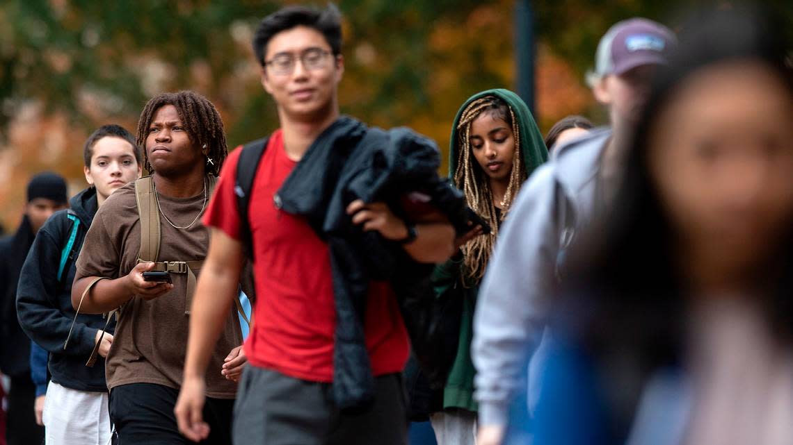 People walk through the campus of UNC-Chapel Hill on Monday, Oct. 31, 2022.