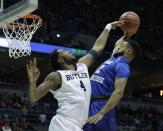 <p>Butler’s Tyler Wideman fouls Middle Tennessee State’s Antwain Johnson as he goes up for a shot during the first half of an NCAA college basketball tournament second-round game Saturday, March 18, 2017, in Milwaukee. (AP Photo/Morry Gash) </p>