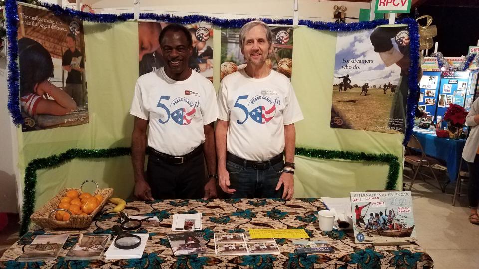 Charlie Clark and Mark Mahoney at Peace Corps Booth at the  2019 Alternative Christmas Market.
