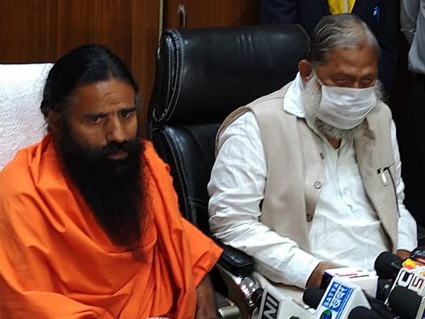 Yoga guru Ramdev (Left) and Haryana Health Minister Anil Vij during a press conference in Chandigarh on Tuesday. (Photo/ANI)
