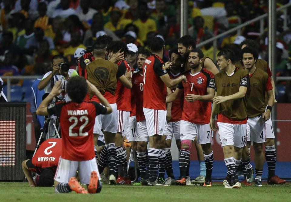 Egypt players celebrate after scoring the opening goal during the African Cup of Nations final soccer match between Egypt and Cameroon at the Stade de l'Amitie, in Libreville, Gabon, Sunday, Feb. 5, 2017. (AP Photo/Sunday Alamba)