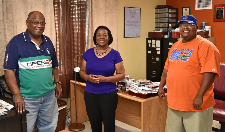 Johnny Hunter Sr., on left, with his son Johnny Hunter Jr., far right, and longtime Tempo News reporter Cynthia Howard, 2020.