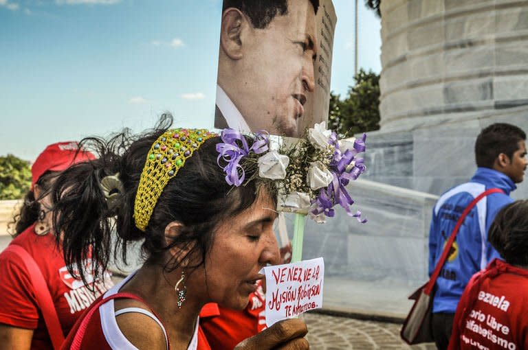 Cubans queue up at Revolution Square in Havana to attend the posthumous tribute to late Venezuelan President Hugo Chavez on March 7, 2013