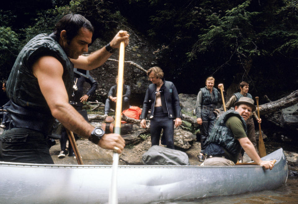 This image released by Warner Bros. Entertainment shows actors Burt Reynolds portraying Lewis Medlock, left, and Ned Beatty as Bobby Trippe, right, in the 1972 film "Deliverance." Four decades ago, the lush northeast Georgia mountains were introduced to the world in the hit film “Deliverance.” Though many in the region still bristle at the movie’s portrayal of locals as uneducated, toothless hillbillies who sodomize visitors from the big city, the film helped create the $20 million rafting and outdoor sports industry along the Chattooga River, which splits Georgia and South Carolina and was the fictional Cahulawassee River in the movie. That’s why the communities along the Chattooga are celebrating the 40th anniversary of the movie’s release with this weekend’s first ever Chattooga River Festival. (AP Photo/Warner Bros. Entertainment)