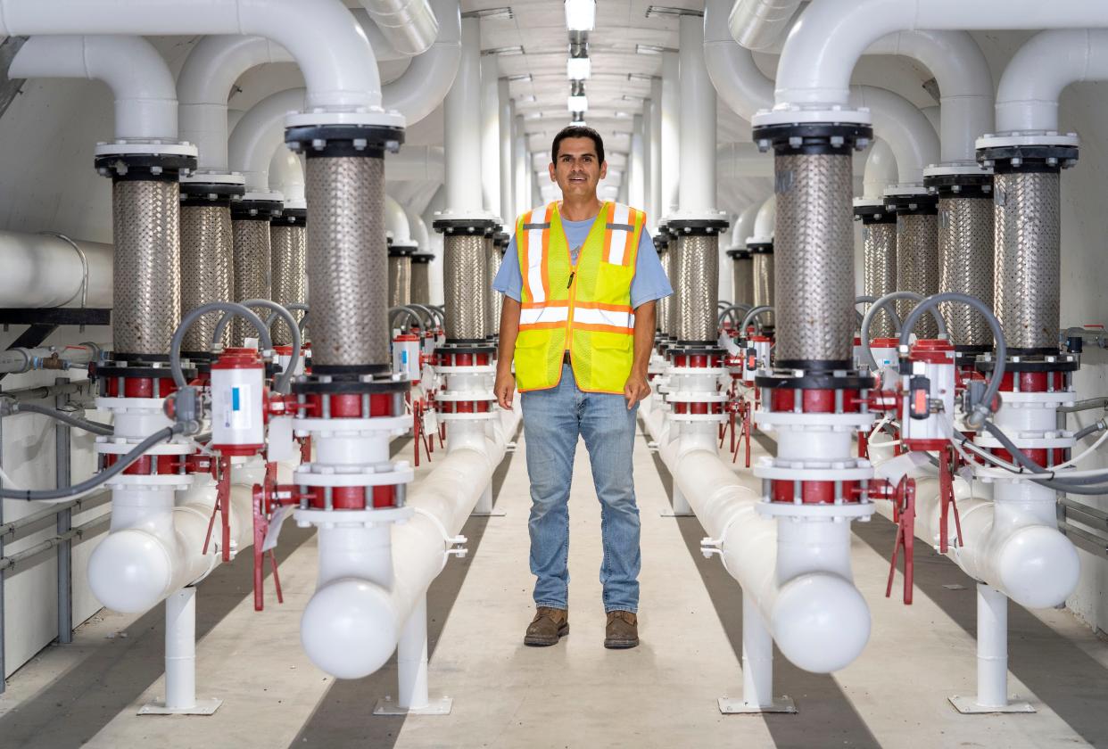 Terminal manager Arnoldo Lara stands in the tunnel of the Ozinga cement terminal at the Port of Palm Beach in Riviera Beach, Florida on August 3, 2023. The facility receives and stores international shipments of cement that are transported to other locations for use in the production of ready-mix concrete.