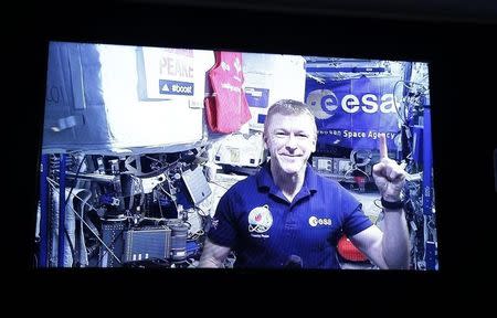 Athletics - 2016 Virgin Money London Marathon Preview - London - 20/4/16 British European Space Agency (ESA) astronaut Tim Peake appears live from the International Space Station for a questions and answers session with assembled media ahead of the 2016 Virgin Money London Marathon Action Images via Reuters / Peter Cziborra Livepic EDITORIAL USE ONLY. - RTX2AU5B