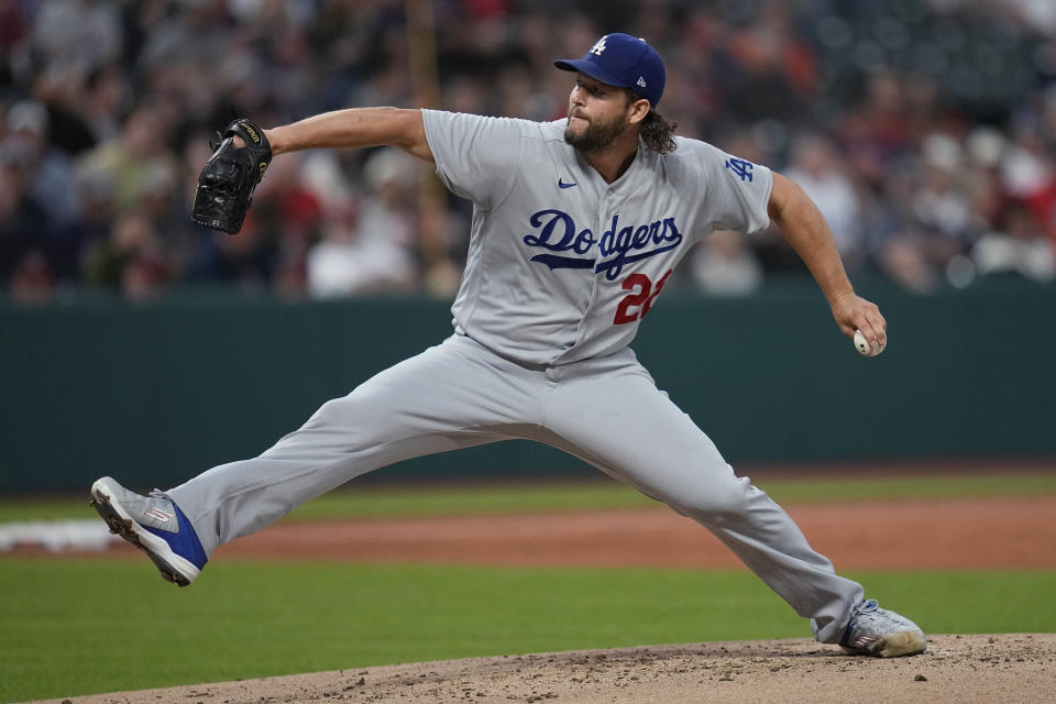 Los Angeles Dodgers' Clayton Kershaw pitches to a Cleveland Guardians batter during the first inning of a baseball game Wednesday, Aug. 23, 2023, in Cleveland. (AP Photo/Sue Ogrocki)