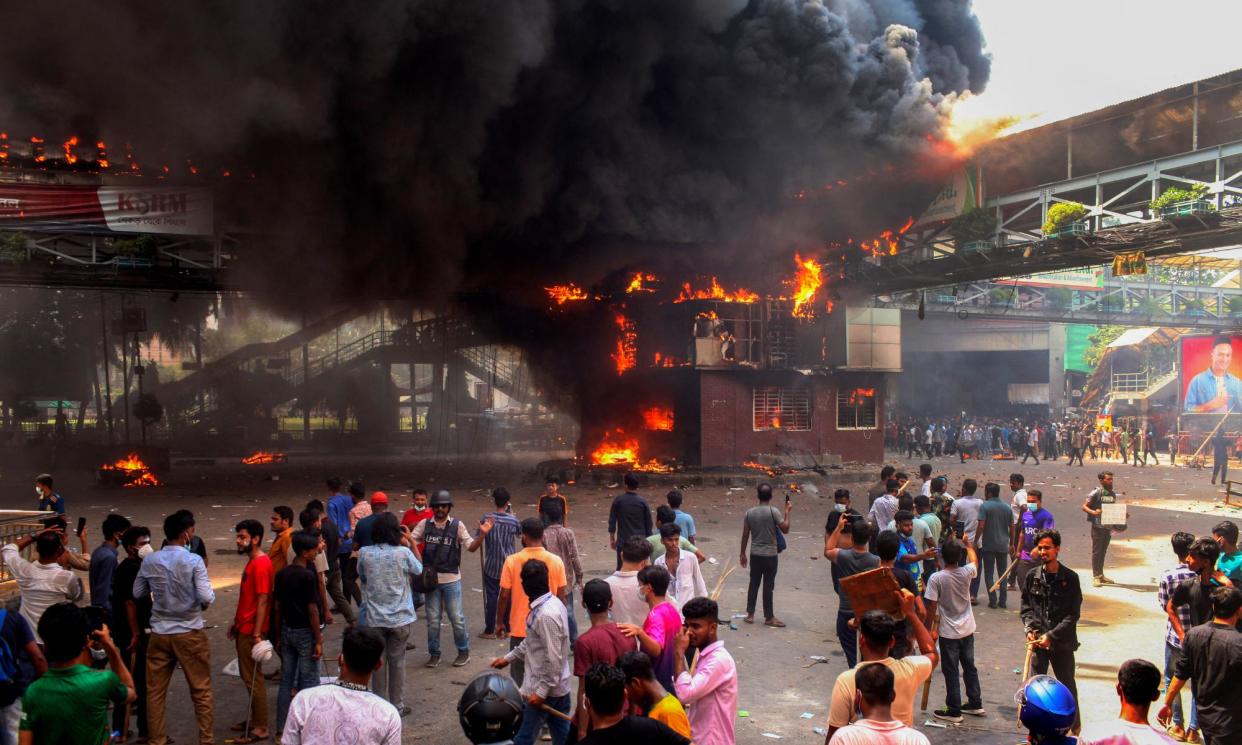 <span>Anti-quota protesters clash with the police in Dhaka on 18 July.</span><span>Photograph: AFP/Getty Images</span>