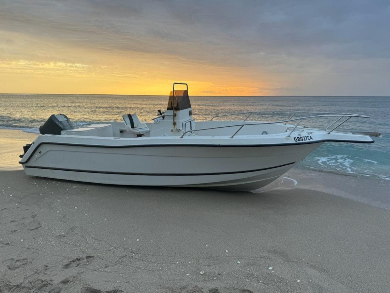 Palm Beach Police say this boat was found abandoned near 1200 N. Ocean Blvd. on Sunday, June 16, 2024. Four people who came ashore were detained.