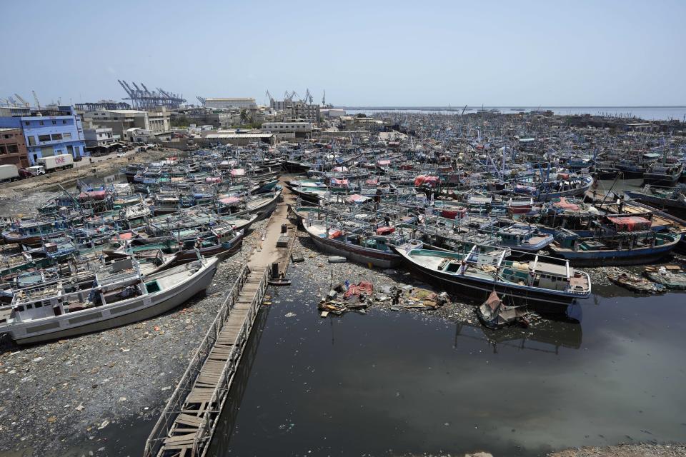 CORRECTS CYCLONE NAME- Fishing boats are anchored at a fishing harbor following authorities alerting fishermen of Cyclone Biparjoy, in Karachi, Pakistan, Saturday, June 10, 2023. India and Pakistan are bracing for the first severe cyclone this year expected to hit their coastal regions later this week, as authorities halted fishing activities and deployed rescue personnel. From the Arabian Sea, Cyclone Biparjoy is aiming at Pakistan’s Sindh province and the coastline of the western Indian state of Gujarat. (AP Photo/Fareed Khan)