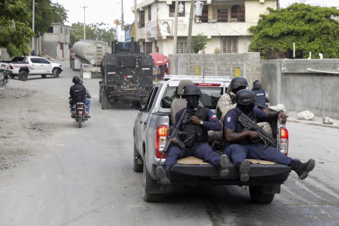 A police convoy escort fuel trucks filled with gas as they drive from the Varreux fuel terminal, in Port-au-Prince, Haiti, on Nov. 8, 2022. (AP Photo/Odelyn Joseph, File)