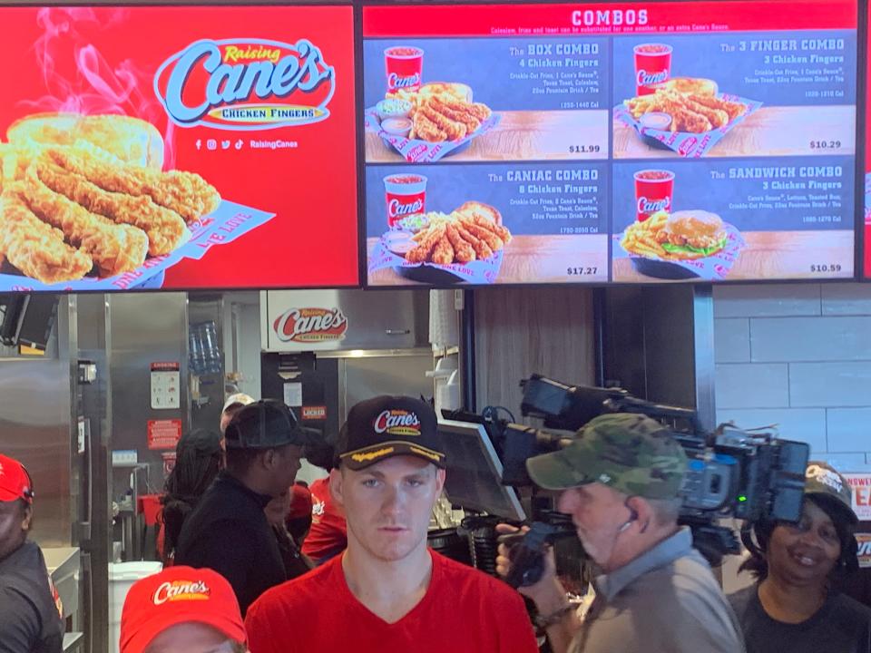 Florida Panthers star Matthew Tkachuk worked behind the front counter Thursday morning at the Raising Cane's restaurant in Pompano Beach, attracting hundreds of fans.