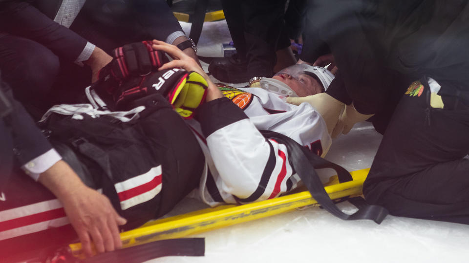 Connor Murphy of the Chicago Blackhawks had to leave on a stretcher after being hit into the boards. (Photo by Richard A. Whittaker/Freestyle Photo/Getty Images)