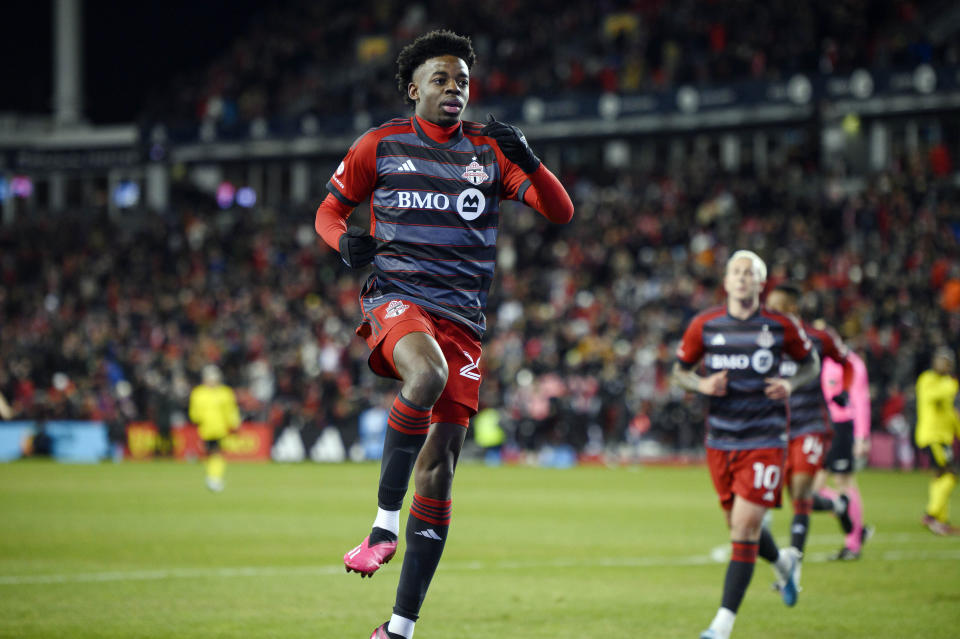 Toronto FC forward Deandre Kerr (29) celebrates after scoring against the Columbus Crew during the first half of an MLS soccer match in Toronto, Saturday, March 11, 2023. (Christopher Katsarov/The Canadian Press via AP)